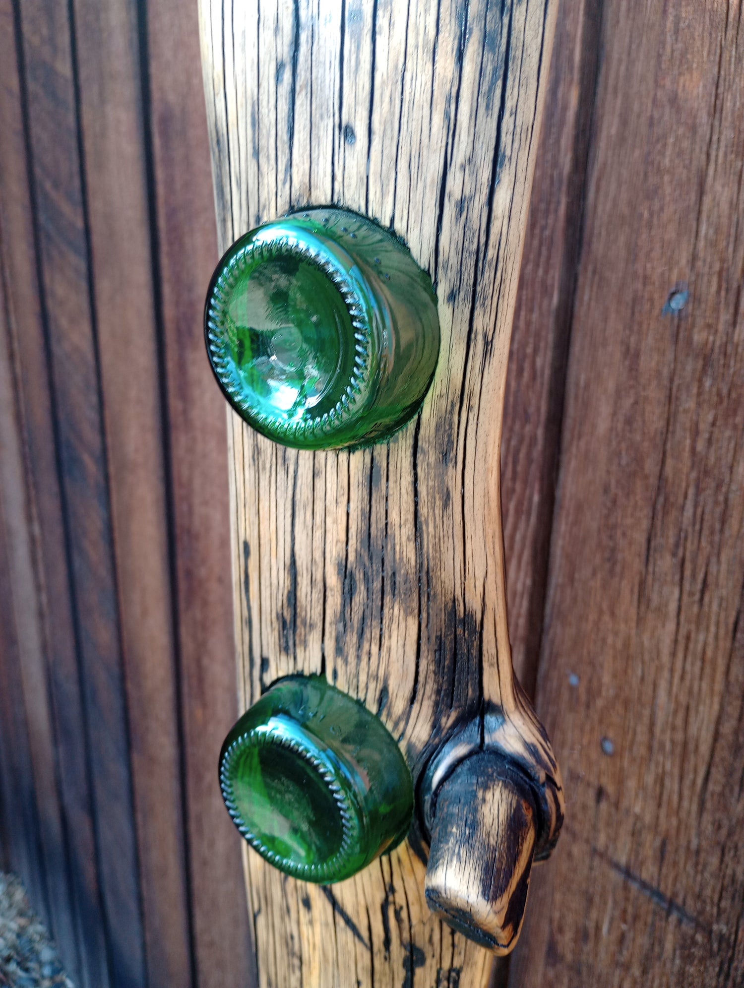 Recycled blue and green glass, copper accents, artistically situated on a conditioned piece of reclaimed wood